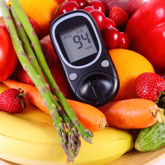 Glucose meter with fruits and vegetables, healthy nutrition, dia