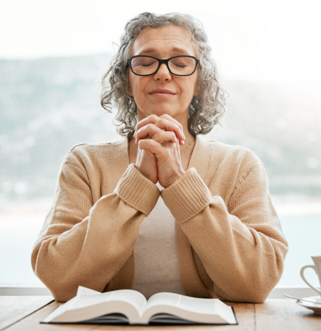 Bible, praying or senior woman in prayer reading book for holy worship, support or hope in Christianity or faith. Relax, meditation or elderly person studying or learning God in spiritual religion