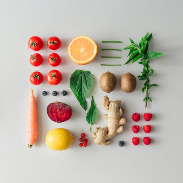 Creative neatly arranged food layout with fruits, vegetables and