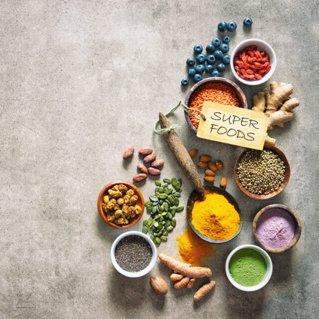 Various colorful superfoods in bowls